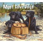 On the cover of the 2025 Calendar "Must Love Dogs" by MyHomeDecor.ca, three black Labrador puppies are depicted in an outdoor setting. They are playfully gathered around a woven basket, with one pup holding a leather strap in its mouth. The charming artwork is credited to Jim Killen.