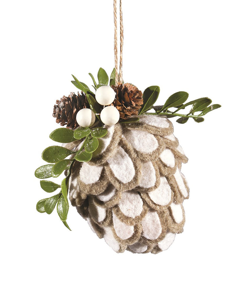 A handcrafted Ornament - Frosted Cone adorned with small pine cones, white berries, and green leaves from MyHomeDecor.ca. Suspended by a piece of twine, this natural ornament is perfect for adding a touch of rustic charm to your home decor.